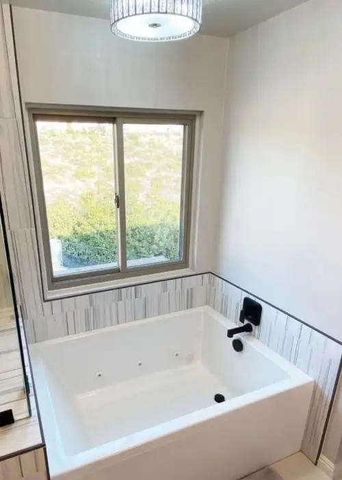 Alcove tub in master bath with wall mounted tub filler